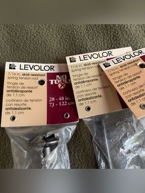 New Levolor 7/16” skid-resistant spring tension rods. Brown. Set of 3.
